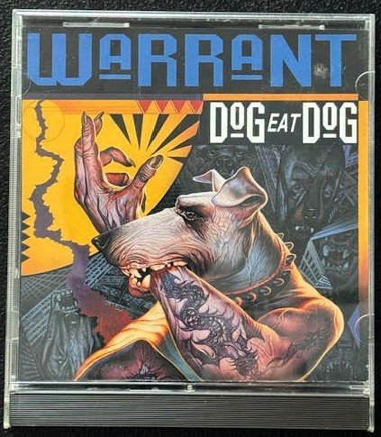 Warrant – Dog Eat Dog (Used) - Maple City Music